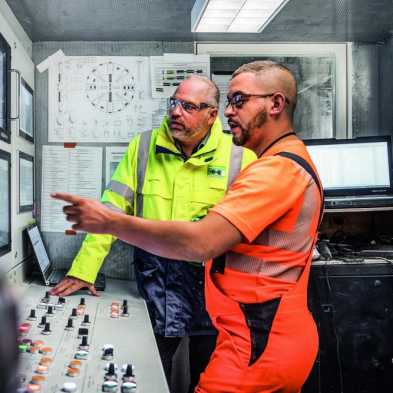 Two operators of a tunnel boring machine