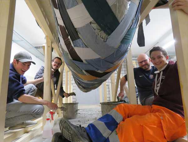 Team of canoe building