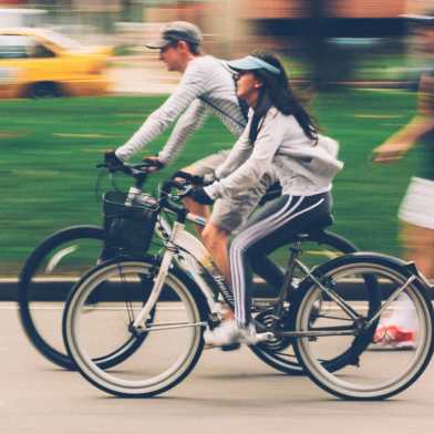 Two people cycling