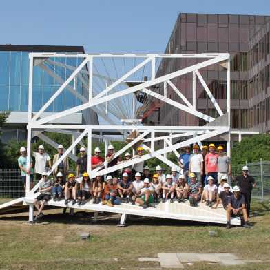 Bird's eye view of the pavilion (left) and from the front (right). The team is gathered round. 