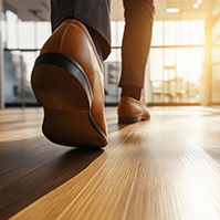 man walks on parquet floor