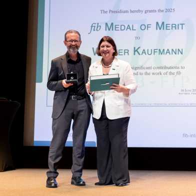 Walter receives the award on the stage