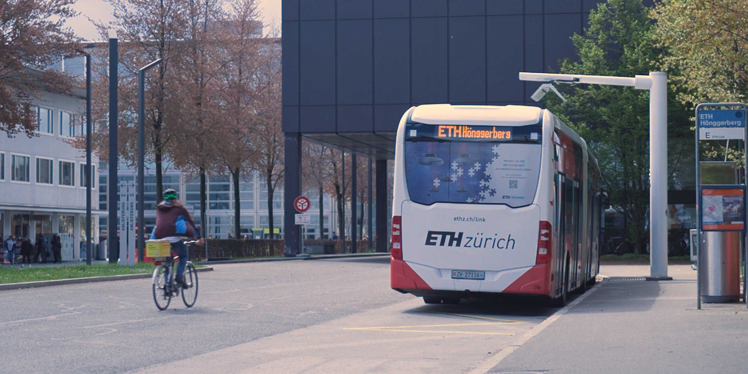 Electric bus and cyclist on ETH Campus Hönggerberg